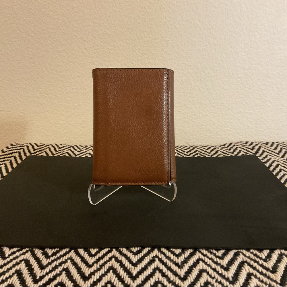 Coach Pebbled Leather Tri-Fold Wallet.